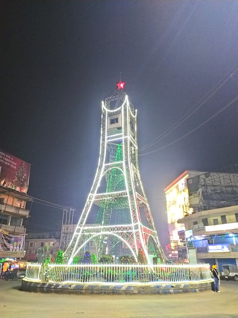 The Clock Tower in Dimapur is seen adorned with Christmas lights on December 11. Lights are often used for decoration in celebration of Christmas. The custom dates back to when candles were used to decorate Christmas trees, symbolizing Christ being the Light of the world. The use of electric lights became popular in the 20th century and has become a customary practice since then. (Morung Photo)